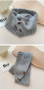 Detail of grey knitted scarf with vintage buttons and elegant wavy ruffle edges