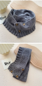 Close-up of grey cable knit neck warmer featuring vintage buttons and ribbed texture