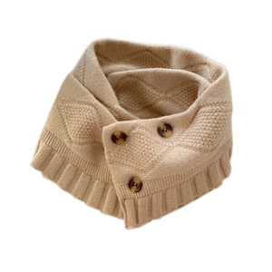 Knitted button neck warmer scarf with ruffled edge and diamond texture in light camel