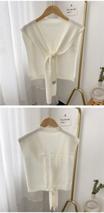 Detailed knit of a white knit shawl wrap for women with front tie and soft texture