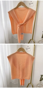Detailed knit texture and tie-knot design of the orange cashmere blend shoulder wrap shawls