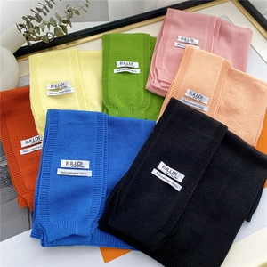 Stack of colorful knitted cashmere shawls in seven vibrant shades for autumn fashion