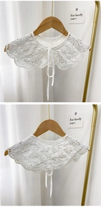 Detail of white floral lace detachable collar with intricate embroidery and tie closure