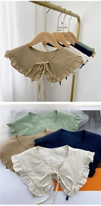 Detail of vintage cotton-linen Peter Pan collars with ruffle trim and bow tie closure