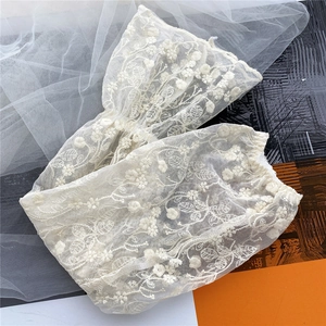 White floral lace arm sleeves with 3D embroidery for elegant sun protection and style