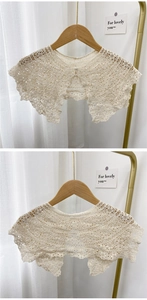 Detail view of floral hollow lace detachable collar with elegant pearl button closure