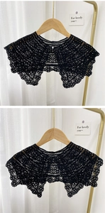 Detail of black crochet lace fake collar with floral pattern and a pearl button