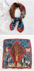 Detailed pattern of a red silk square scarf with golden tree of life and classical motifs