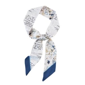 Floral silk hair ribbon with cursive text and blue contrast ends on white background