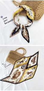 Detail of pleated square silk scarf featuring vintage carriage motifs and chain patterns