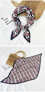Detail of pleated silk scarf with red and blue chain pattern and vintage French style