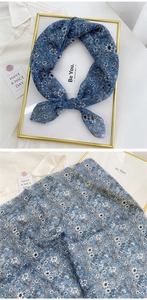 Detailed close-up of blue floral cotton linen square scarf with delicate petal patterns