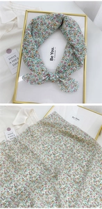 Detail of floral cotton linen neckerchief showing delicate small flower patterns