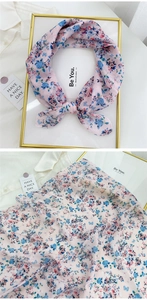 Close-up of floral cotton linen neckerchief with pink and blue flower patterns