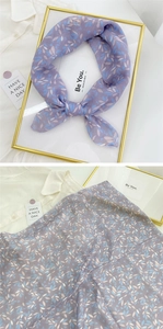 Close-up of lavender floral cotton linen scarf with soft translucent leaf patterns