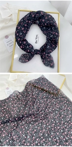 Close-up of floral cotton-linen scarf showing delicate prints and fabric texture