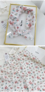 Detailed close-up of floral cotton linen neckerchief with pink and yellow flowers