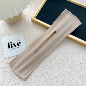Detail of minimalist beige fabric hair bun maker with premium stitching for women