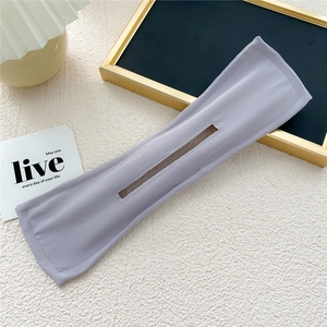Detailed flat lay of lavender chiffon deft bun hair tool with central slot and neat stitching