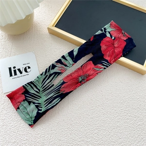 Detail of navy blue floral fabric hair bun maker with inner wire for quick styling