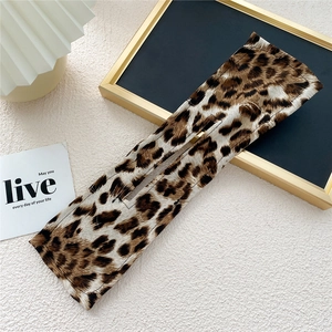 Detail of leopard print hair bun maker with aluminum wire and central slot opening