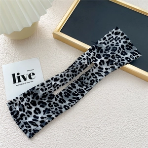 Macro detail of leopard print hair bun maker with inner wire for elegant styling