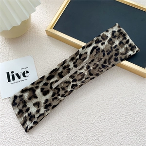 Detailed view of leopard print fabric hair bun maker with inner wire for styling
