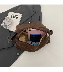 Top view of the spacious brown matte tote bag interior showing capacity for tablets and phones