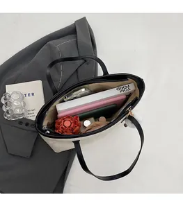 Top view of large capacity tote bag showing spacious interior with books and daily items