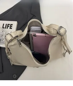 Top view of large cream leather tote showing spacious interior for a tablet and gear