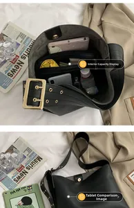 Détails de l'intérieur d'un grand sac seau en cuir noir avec large bandoulière