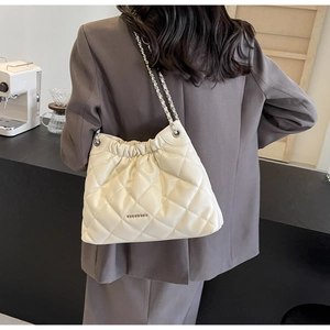 Quilted cream leather bucket bag with elegant chain strap and gold logo detail