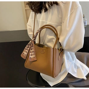 Brown lychee leather tote bag with checkerboard silk scarf detail and embossed logo