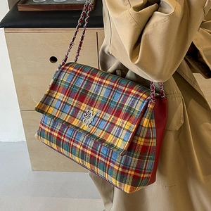 Plaid canvas tote bag with red leather trim and chain strap for autumn winter style