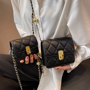 Quilted black leather shoulder bags with gold hardware and chain strap for women