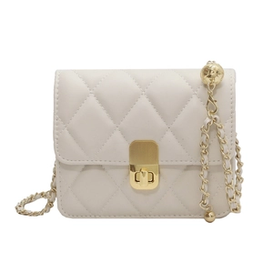 Elegant cream quilted crossbody bag with golden chain and orb charm for women