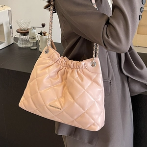 Chic quilted pink bucket bag with chain strap and metallic logo for elegant styling