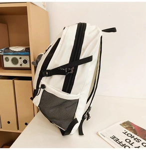 Detail view of large capacity nylon backpack with side mesh pocket and buckle strap