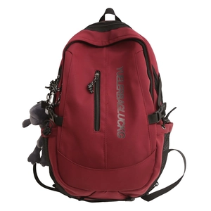 Large capacity wine red student backpack with side mesh pockets and plush charm