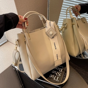 Chic beige bucket bag with gold ring handle and FASHION wide fabric strap