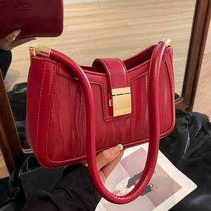 Elegant red bridal handbag with textured faux leather and gold metal clasp closure