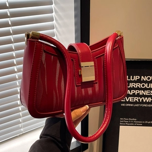 Elegant red wedding handbag with vertical wave texture and gold lock for brides