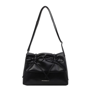 Elegant black leather tote bag with stylish bow details and adjustable shoulder strap
