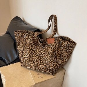 Large capacity leopard print canvas tote bag with brown leather handles and metal rivets