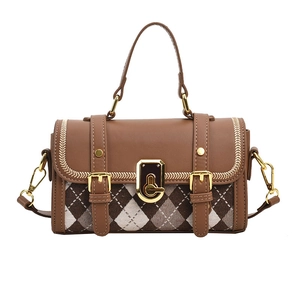 Vintage brown plaid satchel bag with gold buckle closure and top handle on white background