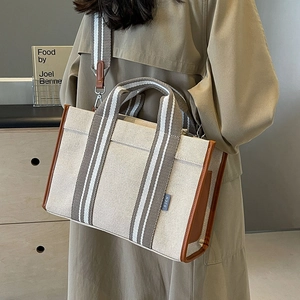 Sac fourre-tout en toile beige avec bordure en cuir et bandoulière rayée femme