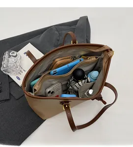 Top view showing the large interior storage space and compartments of the brown tote bag