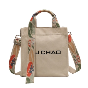 Schicke Canvas-Beuteltasche mit floralen Webgurten und verstellbarem Umhängeriemen