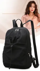 Detail of waterproof nylon backpack with drawstring pocket and metallic zippers