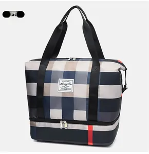 Détail du sac de voyage Oxford à carreaux avec poignées et compartiment à chaussures